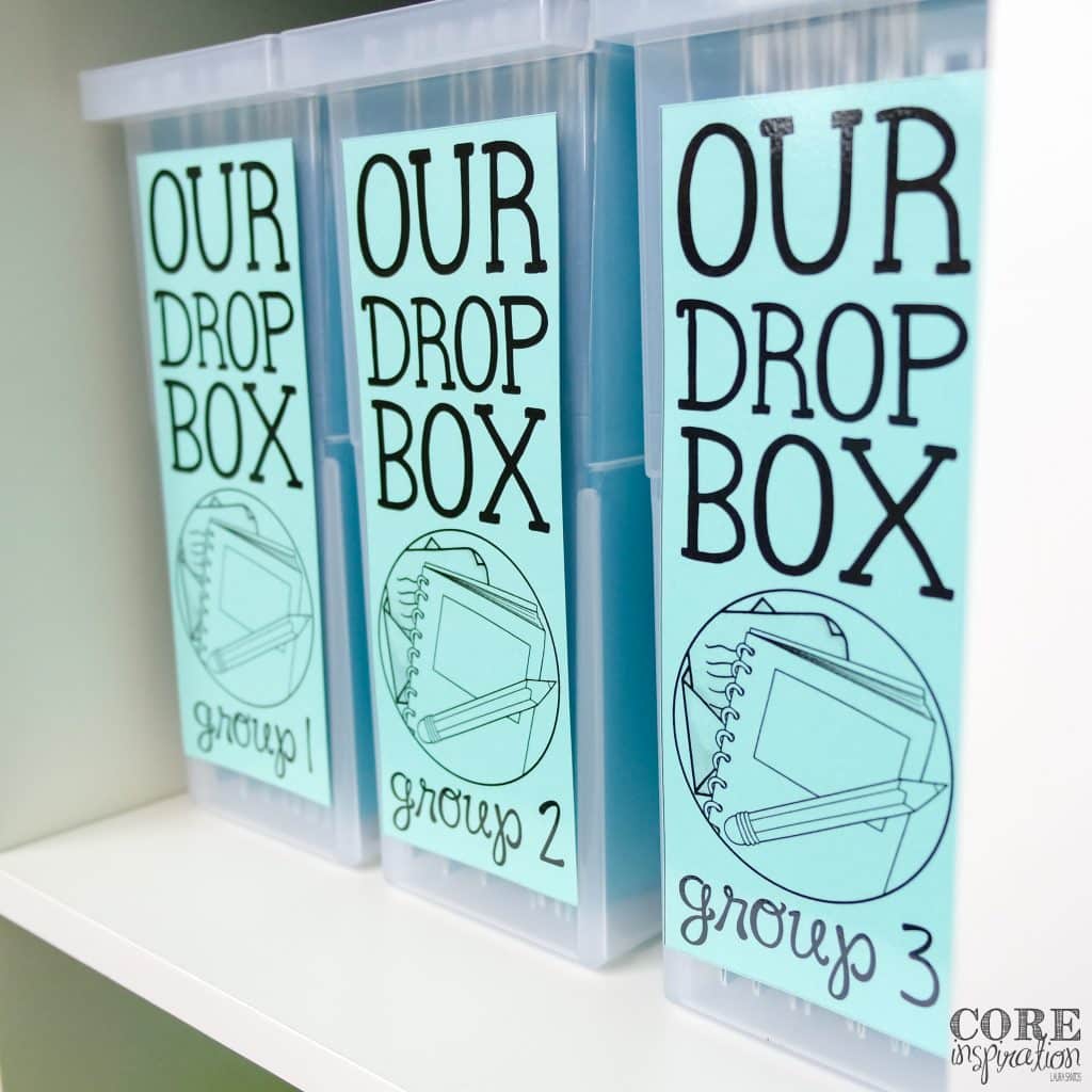 Core Inspiration Homework Drop Boxes sitting side by side on white shelf. 